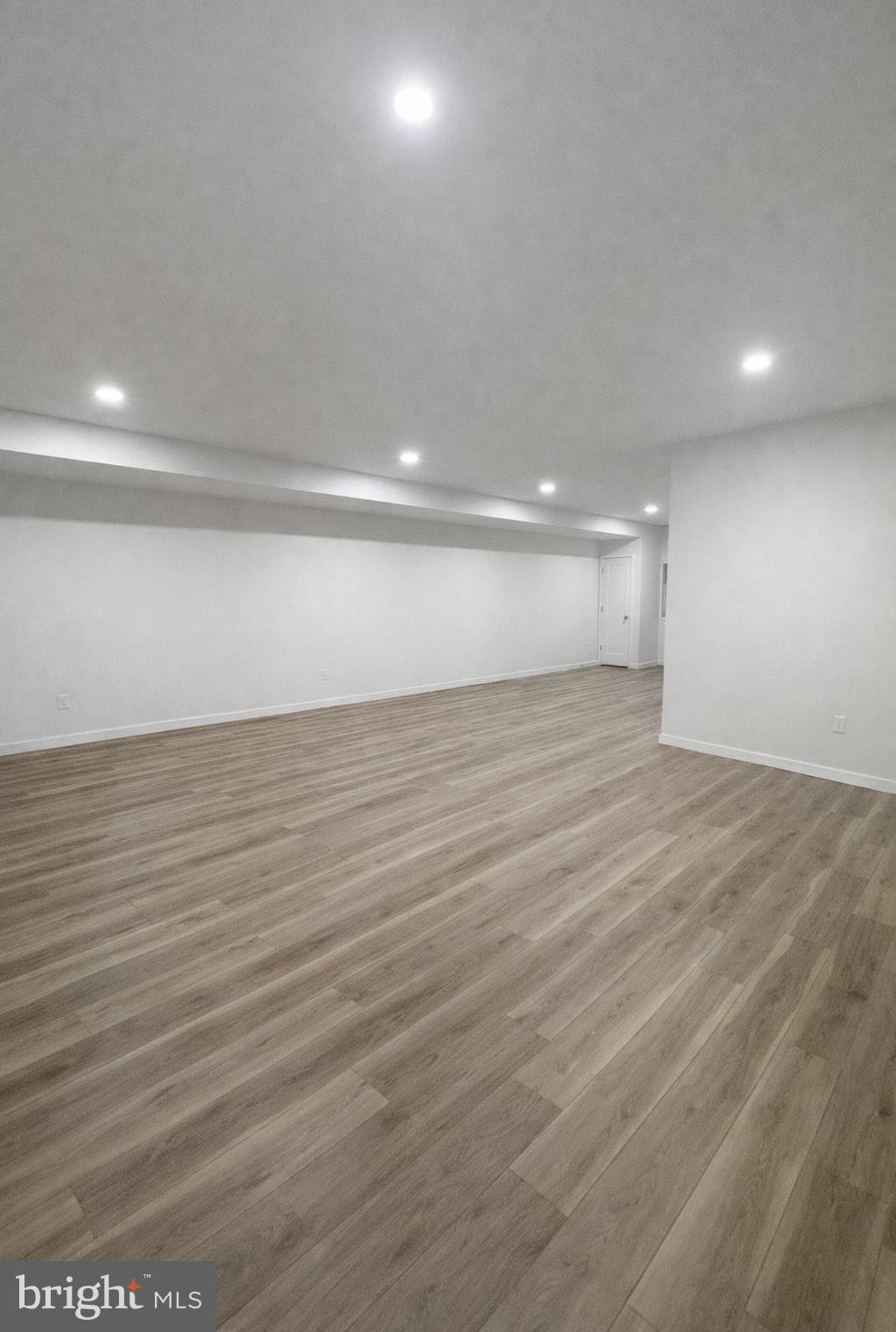 415 Almonesson Road Blackwood, NJ 08012 - Photo 25 of 26 an empty room with wooden floor and windows