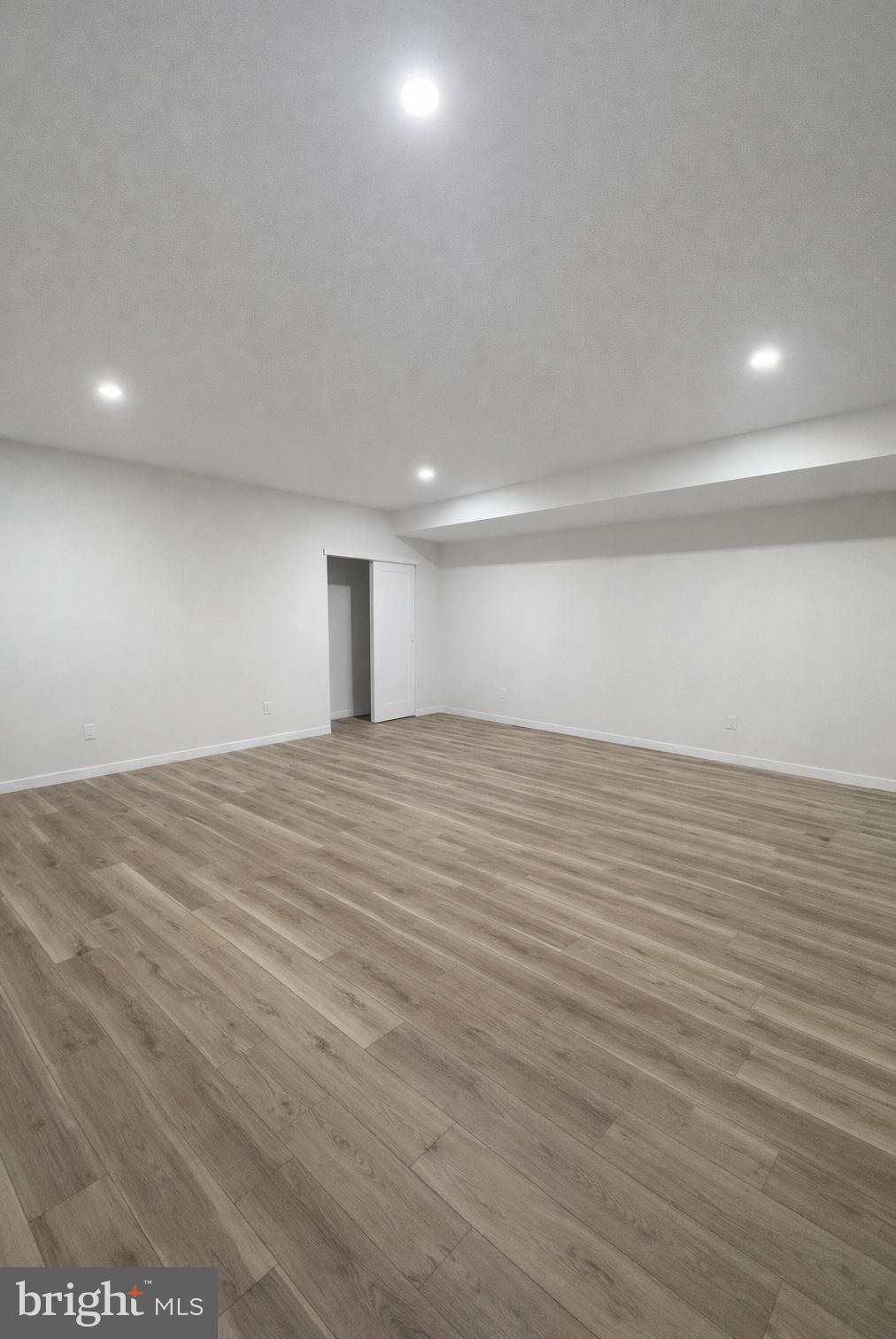 415 Almonesson Road Blackwood, NJ 08012 - Photo 26 of 26 an empty room with wooden floor and windows