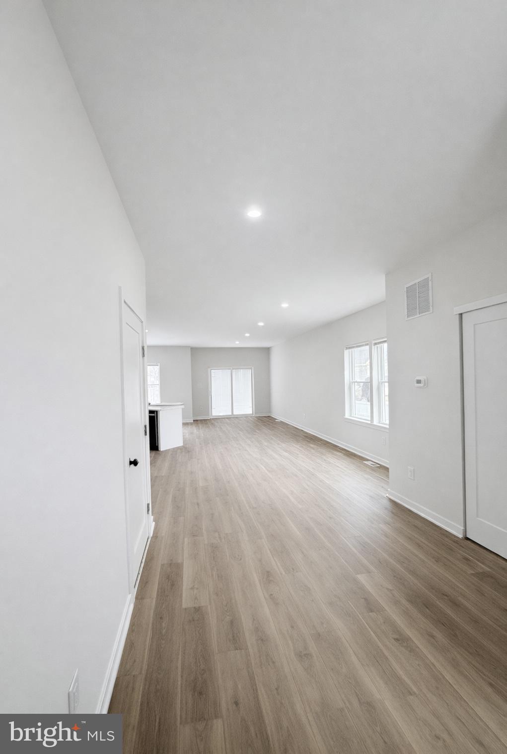 415 Almonesson Road Blackwood, NJ 08012 - Photo 4 of 26 wooden floor in an empty room with a window