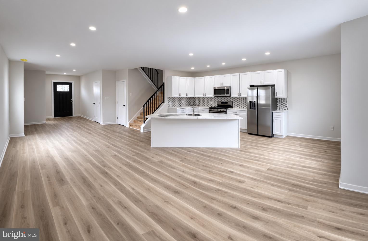 415 Almonesson Road Blackwood, NJ 08012 - Photo 5 of 26 a view of kitchen with kitchen island wooden floor center island and stainless steel appliances