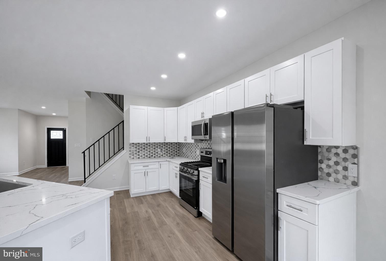 415 Almonesson Road Blackwood, NJ 08012 - Photo 6 of 26 a kitchen with stainless steel appliances granite countertop a refrigerator a sink a stove and oven