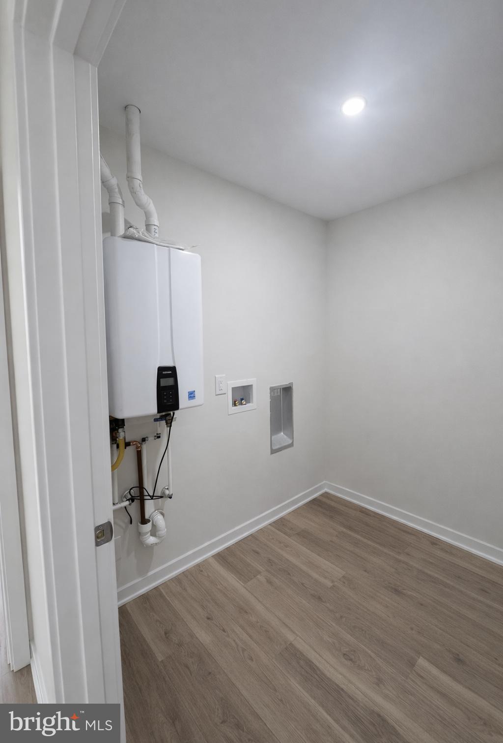415 Almonesson Road Blackwood, NJ 08012 - Photo 10 of 26 a view of a livingroom with a chair and wooden floor