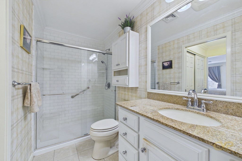 700 Shore Drive, Unit 509 Fall River, MA 02721 - Photo 15 of 25 a bathroom with a granite countertop sink toilet and shower