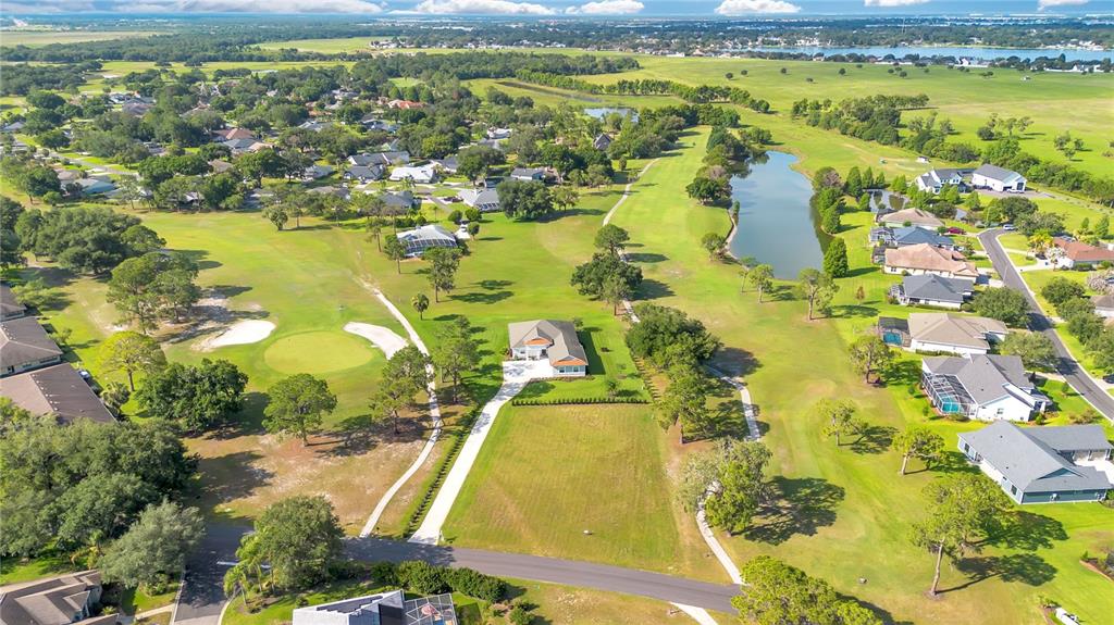 440 Palma Ceia Road Winter Haven, FL 33884 - Photo 66 of 78 a view of a lake with a trees