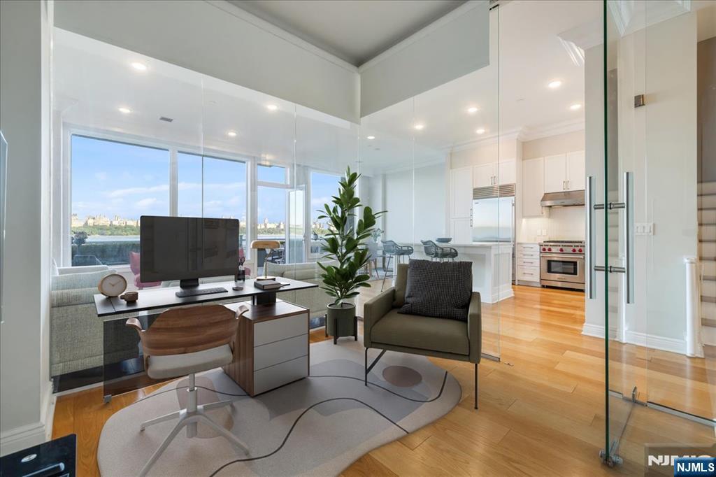3 Somerset Lane, Unit 113 Edgewater, NJ 07020 - Photo 18 of 32 a living room with stainless steel appliances furniture a flat screen tv and a view of kitchen