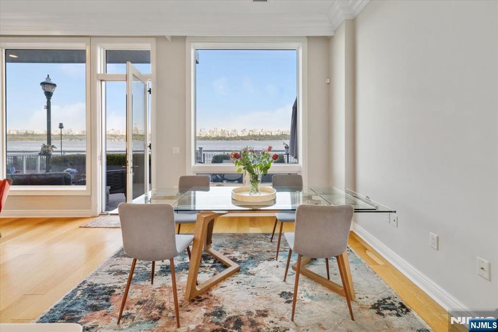 3 Somerset Lane, Unit 113 Edgewater, NJ 07020 - Photo 10 of 32 a view of a dining room with furniture window and outside view