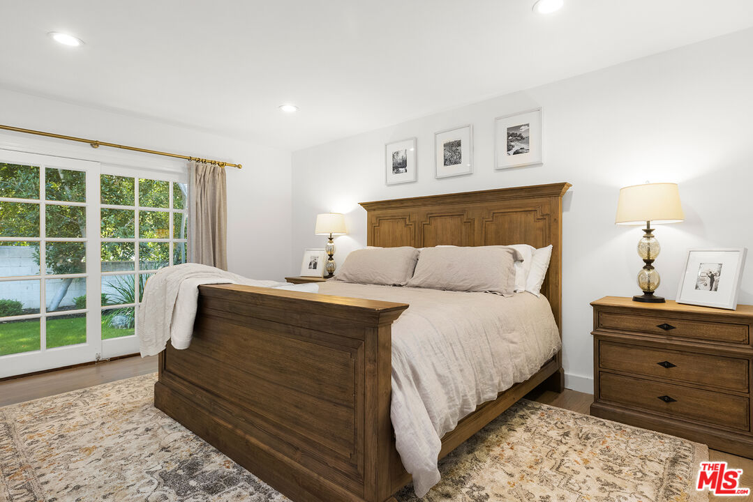 3404 Merrimac Road Los Angeles, CA 90049 - Photo 14 of 29 a bedroom with a bed and a window