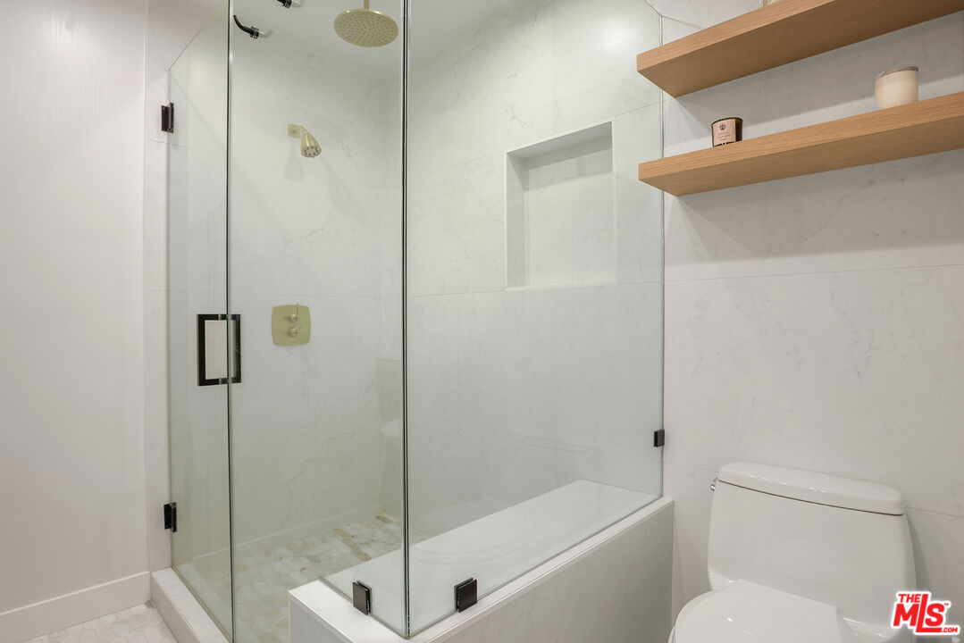 3404 Merrimac Road Los Angeles, CA 90049 - Photo 17 of 29 a bathroom with a shower and toilet