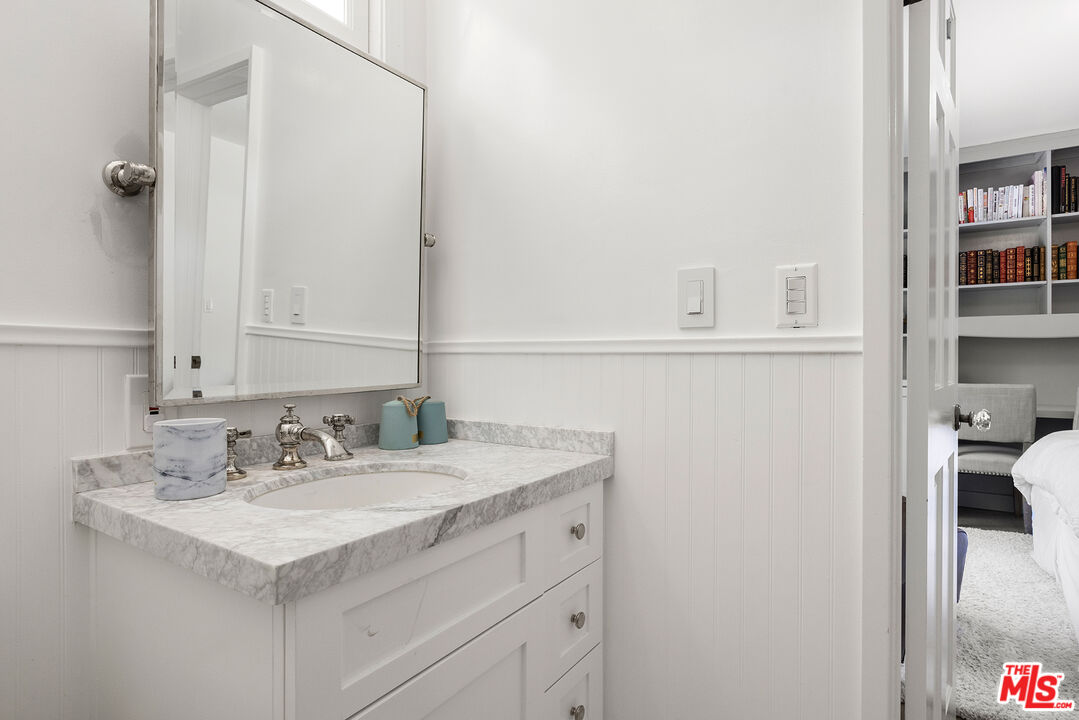 3404 Merrimac Road Los Angeles, CA 90049 - Photo 21 of 29 a bathroom with a sink and a mirror