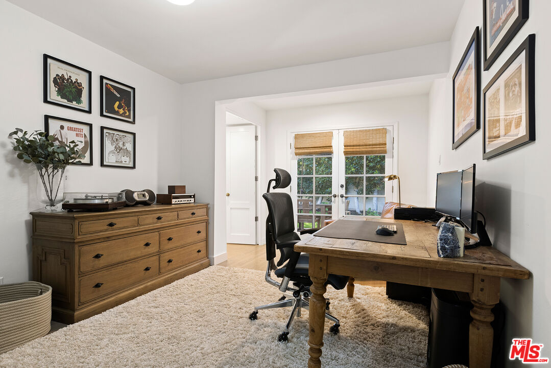 3404 Merrimac Road Los Angeles, CA 90049 - Photo 25 of 29 a view of a workspace with furniture and a window