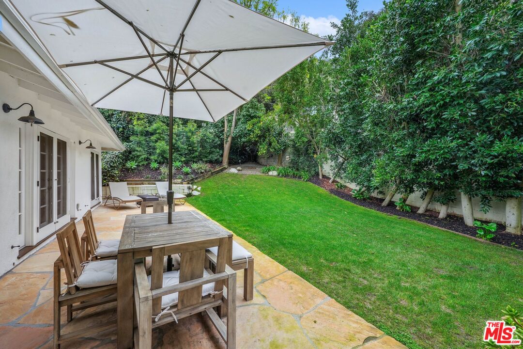 3404 Merrimac Road Los Angeles, CA 90049 - Photo 28 of 29 a patio with a yard table and chairs