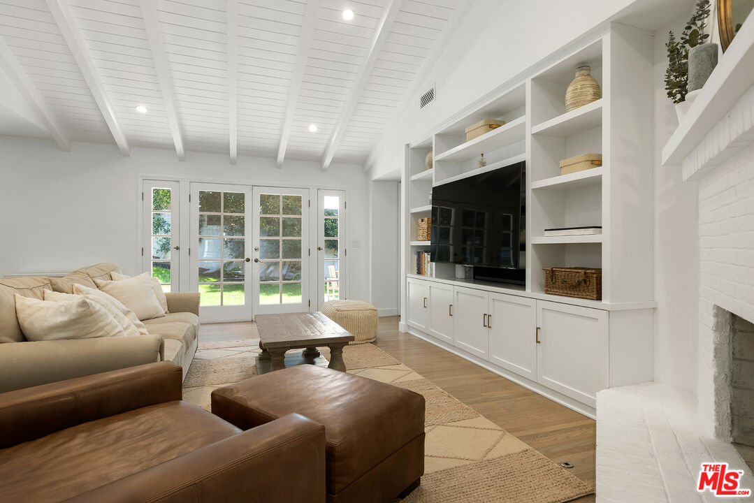 3404 Merrimac Road Los Angeles, CA 90049 - Photo 5 of 29 a living room with furniture window and a flat screen tv