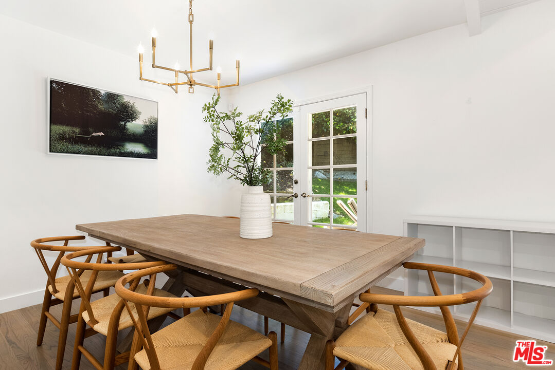 3404 Merrimac Road Los Angeles, CA 90049 - Photo 9 of 29 a view of a dining room with furniture and wooden floor