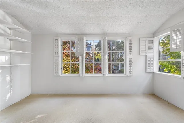 an empty room with windows