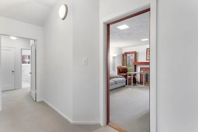 a view of living room with furniture and a painting