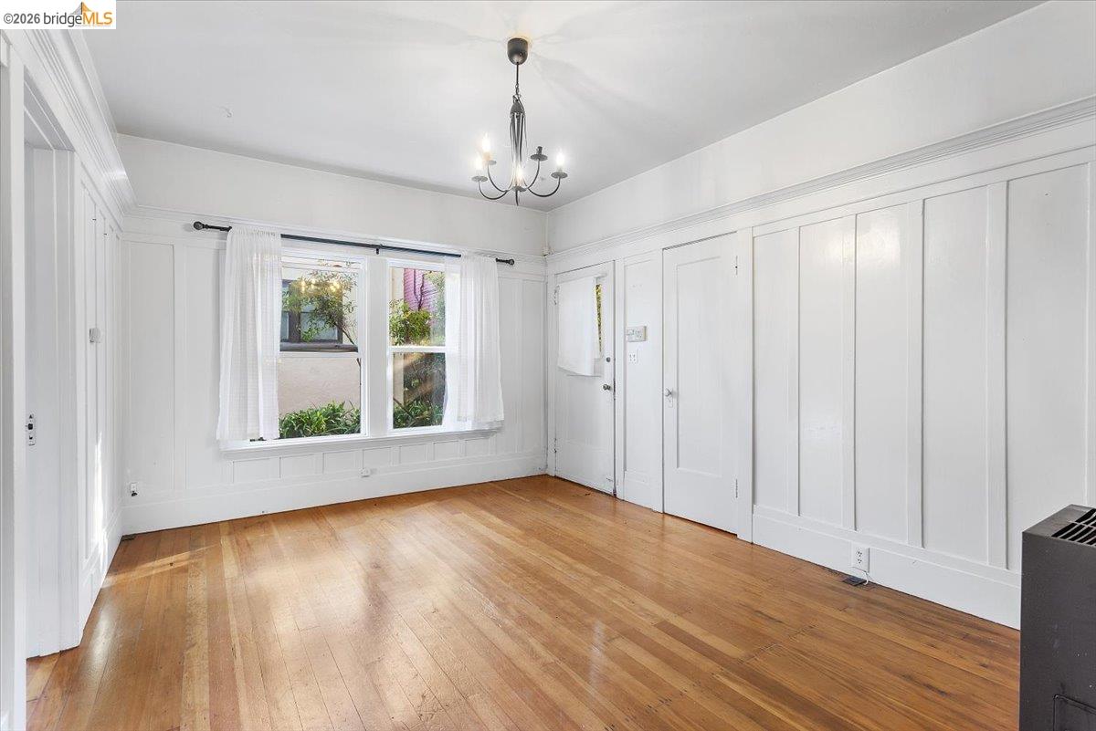 2702 Dana Street Berkeley, CA 94705 - Photo 29 of 37 a view of an empty room with wooden floor and a window