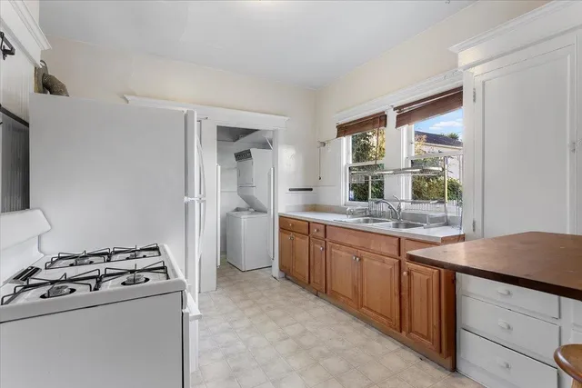 a kitchen that has a sink and a stove