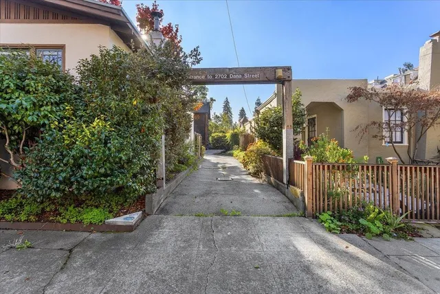 a view of a house with brick walls