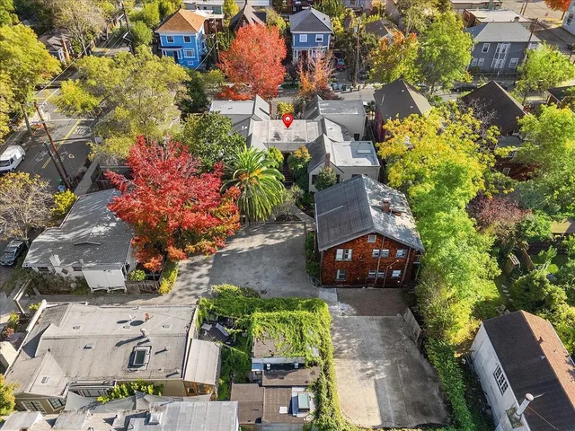 an aerial view of a house with a yard