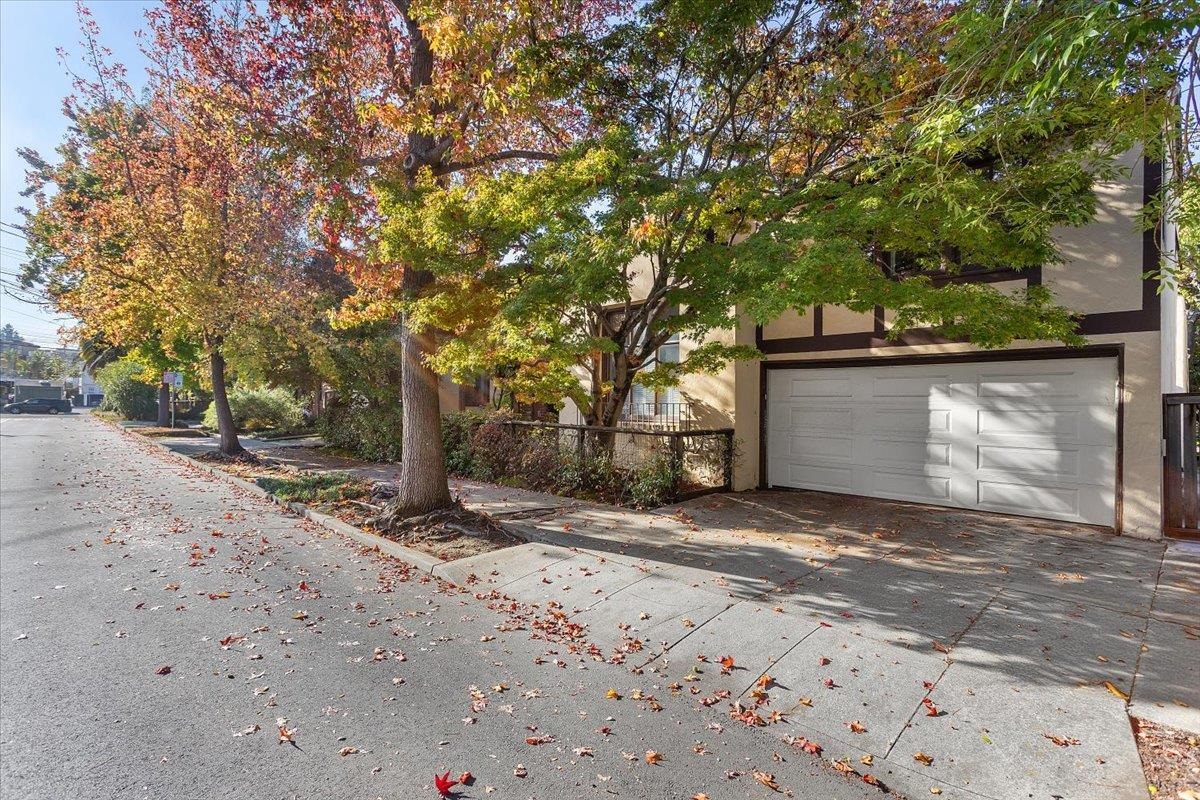 2702 Dana Street Berkeley, CA 94705 - Photo 4 of 37 View of property exterior featuring a garage, stucco siding, and driveway