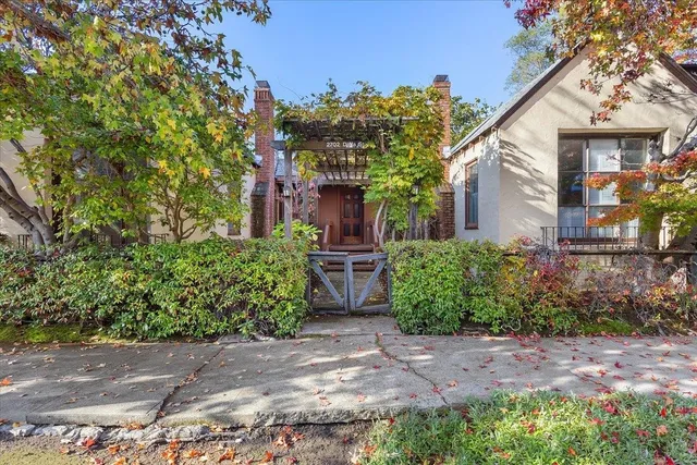 front view of a house with potted plants