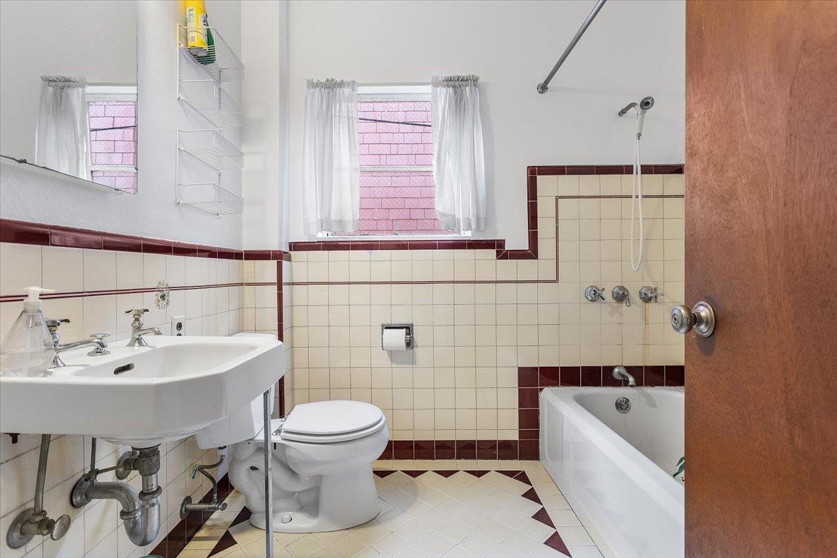 2702 Dana Street Berkeley, CA 94705 - Photo 10 of 37 Full bath featuring light tile patterned floors, washtub / shower combination, and tile walls