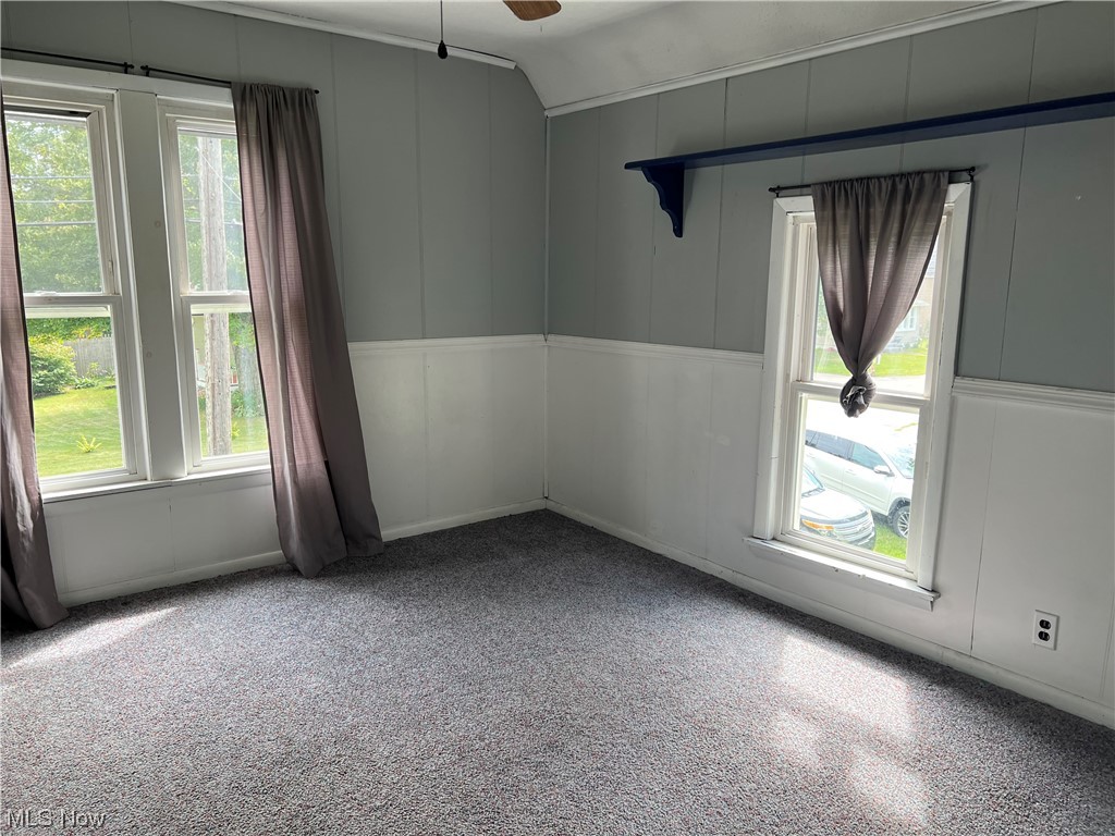 399 Furnace Road Conneaut, OH 44030 - Photo 26 of 29 Carpeted spare room featuring vaulted ceiling