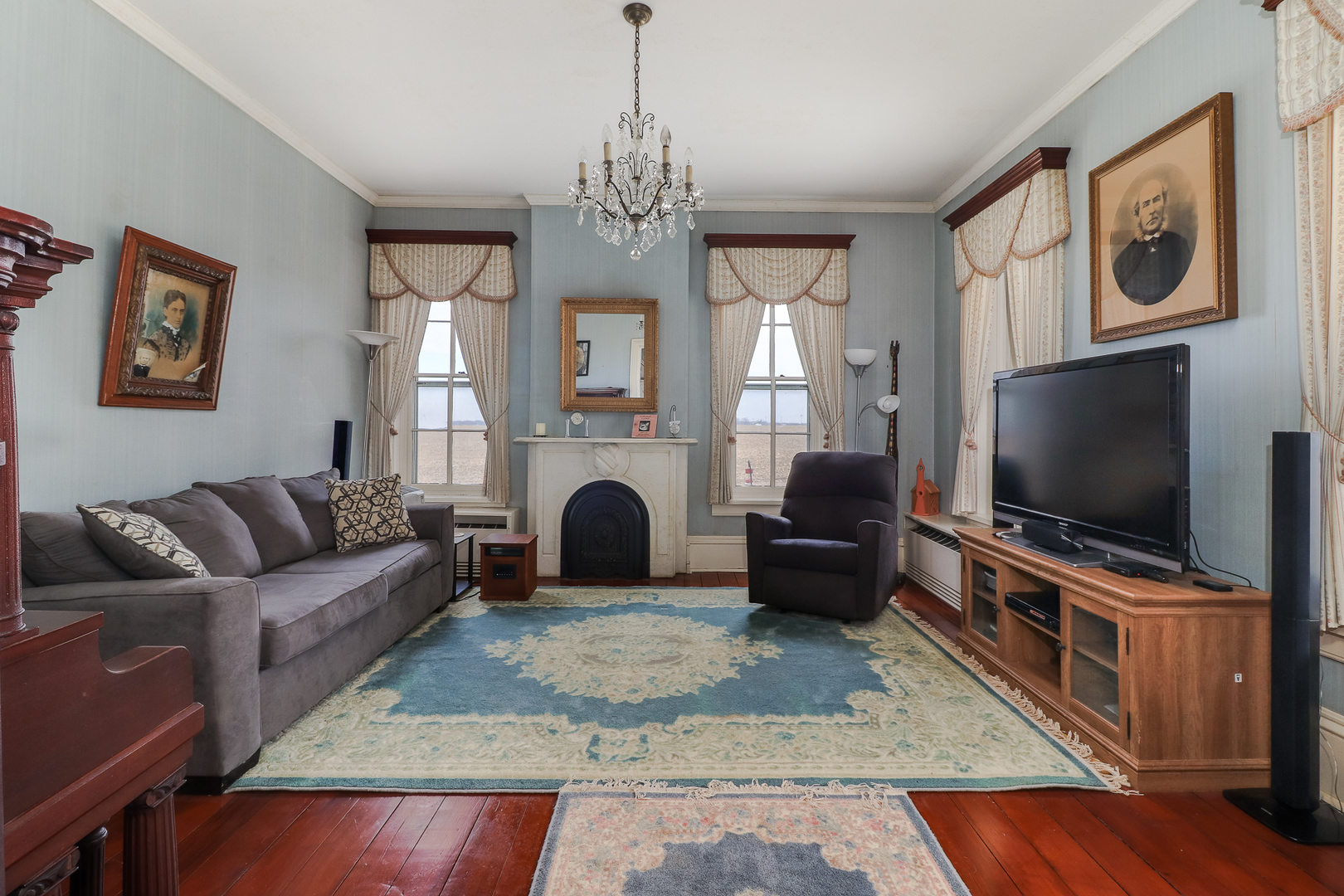 367 Horner Road Armington, IL 61721 - Photo 13 of 50 a living room with furniture a flat screen tv and a fireplace