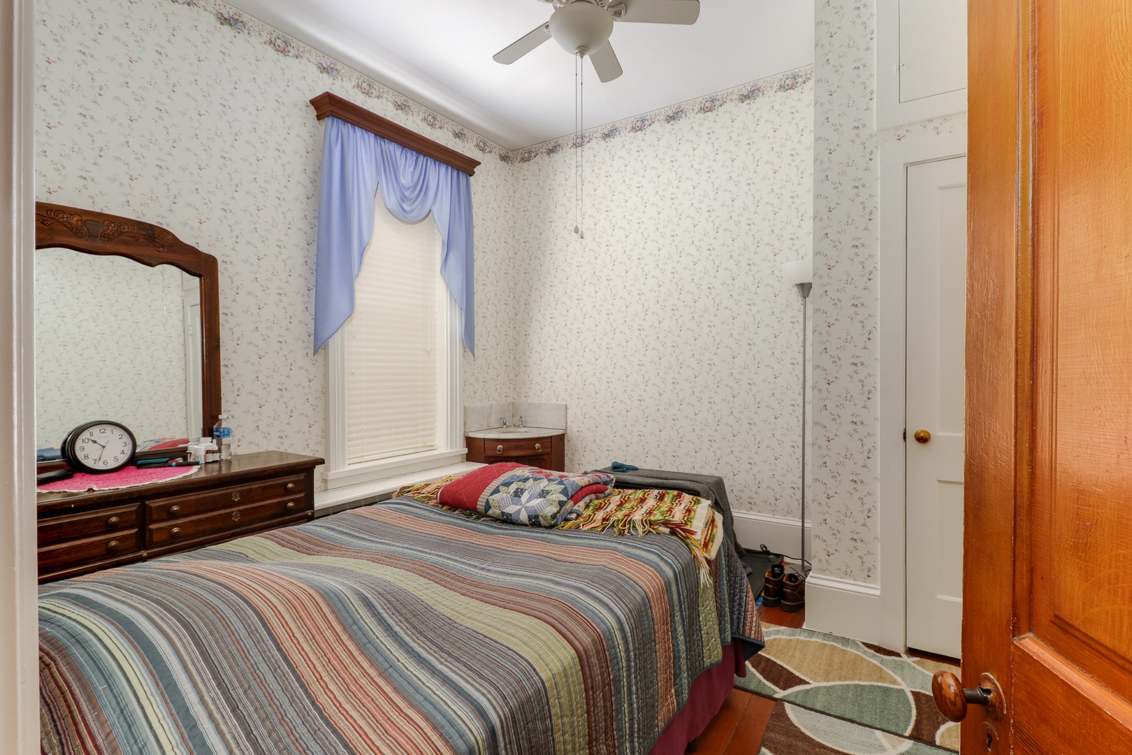 367 Horner Road Armington, IL 61721 - Photo 28 of 50 a bedroom with a bed and a chandelier