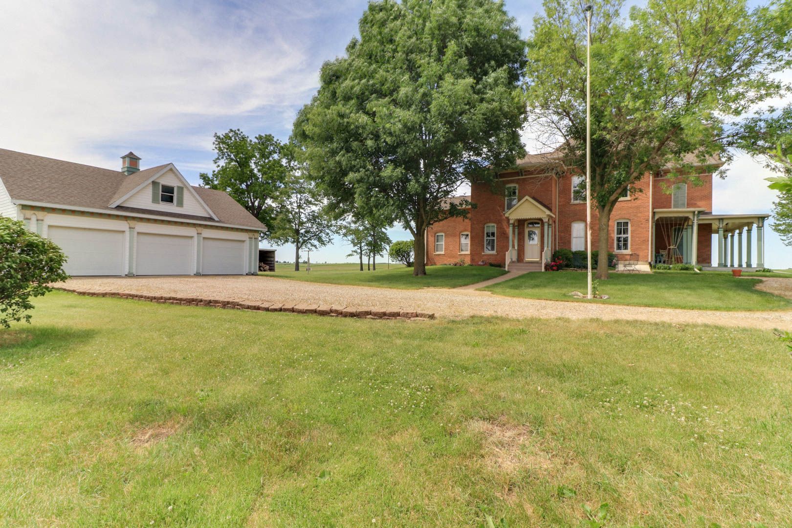 367 Horner Road Armington, IL 61721 - Photo 3 of 50 a front view of a house with a garden and trees