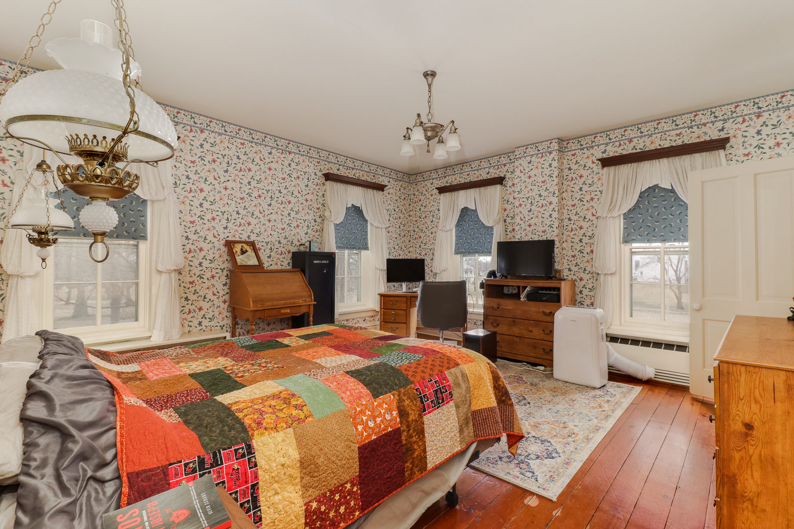 367 Horner Road Armington, IL 61721 - Photo 36 of 50 a bedroom with a bed and wooden floor