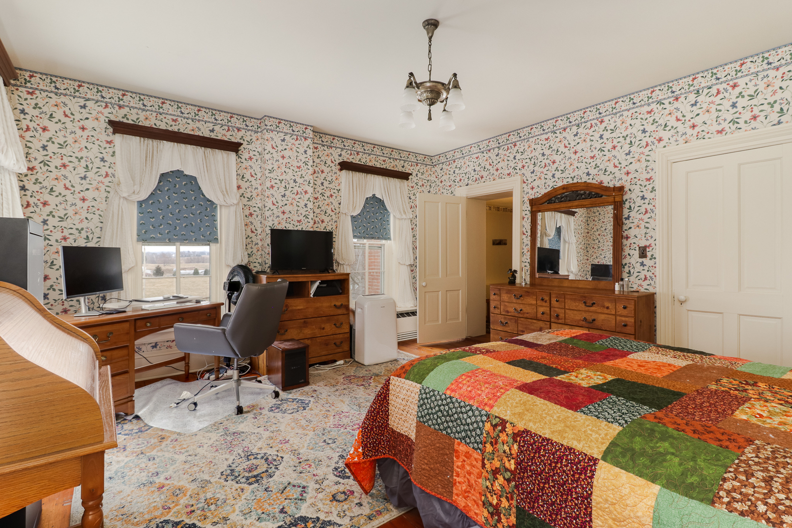 367 Horner Road Armington, IL 61721 - Photo 37 of 50 a bedroom with a bed and a flat screen tv