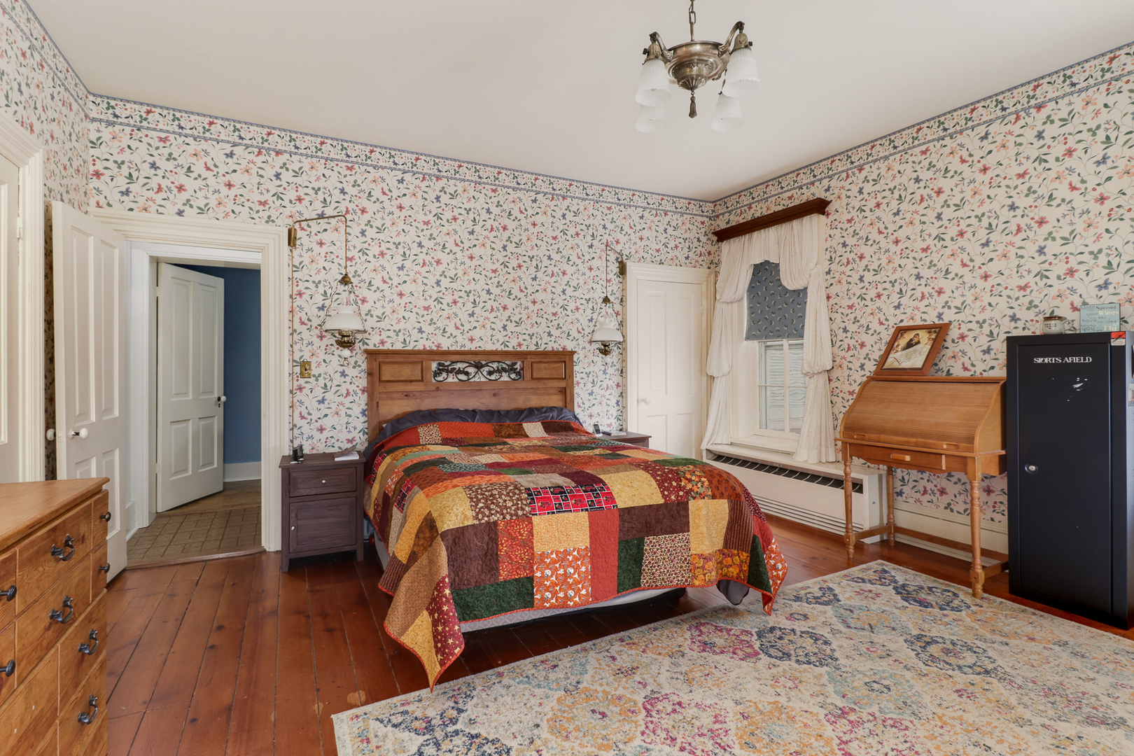 367 Horner Road Armington, IL 61721 - Photo 38 of 50 a bedroom with a bed and wooden floor