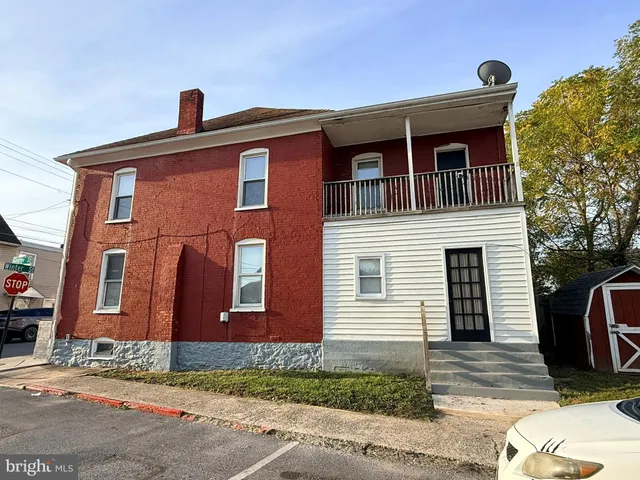 a front view of a house with garage