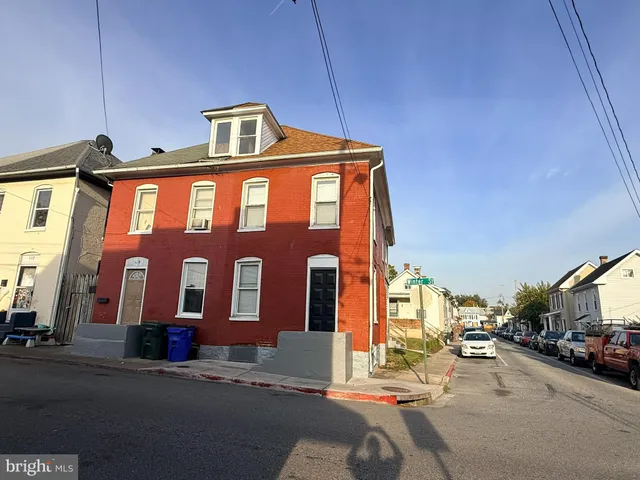 a front view of a building with street view