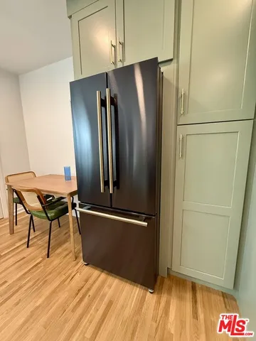 a kitchen with a stove and a refrigerator