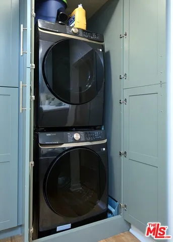 a bathroom with a shower curtain and a sink