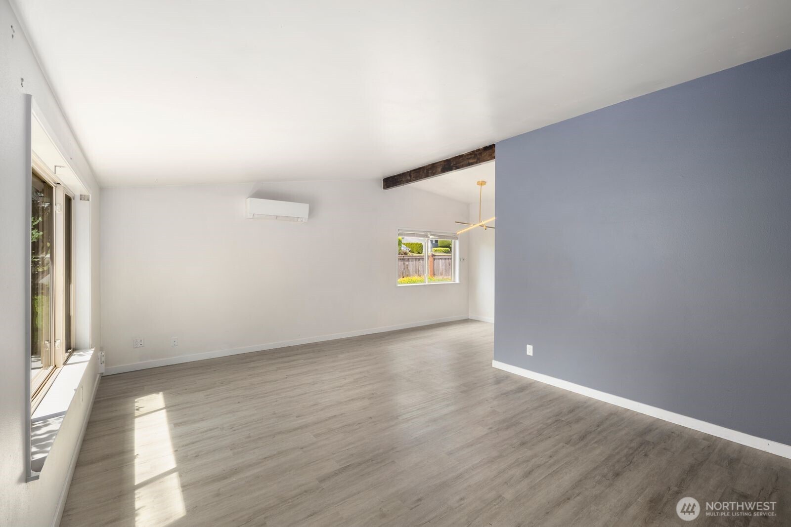101 161st Street Southeast Bothell, WA 98012 - Photo 8 of 34 an empty room with wooden floor and windows