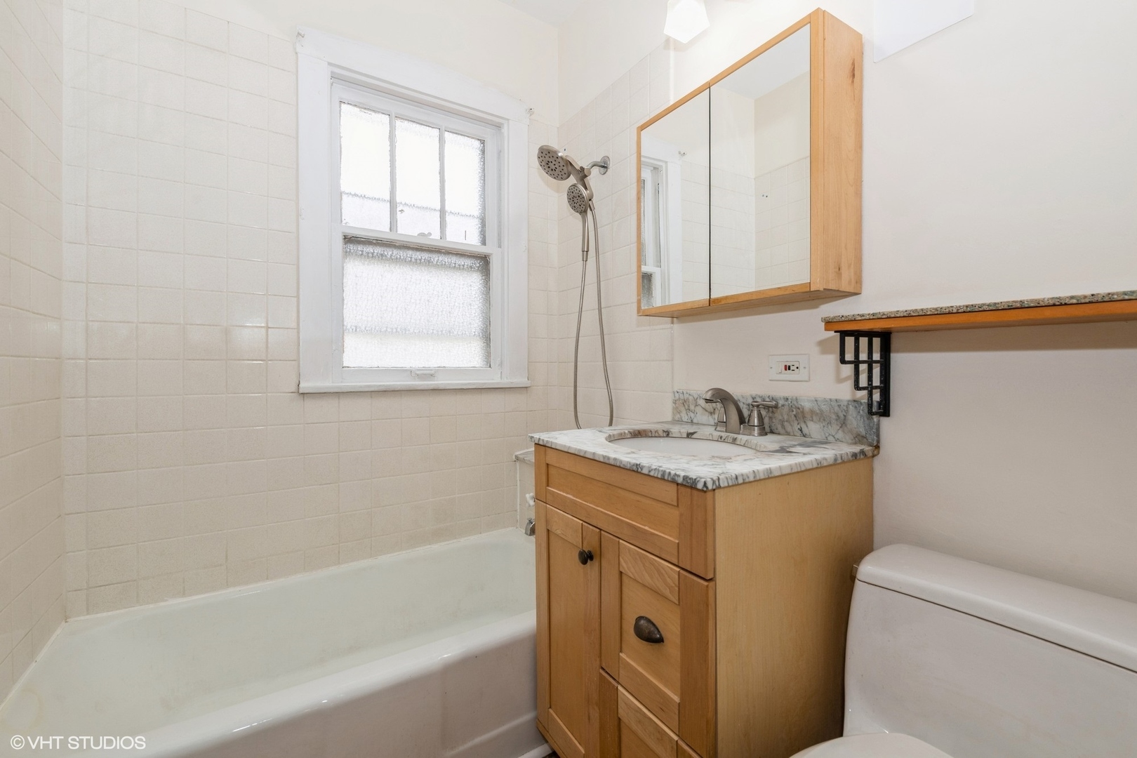 435 Jackson Boulevard Forest Park, IL 60130 - Photo 13 of 19 a bathroom with a granite countertop sink toilet and shower