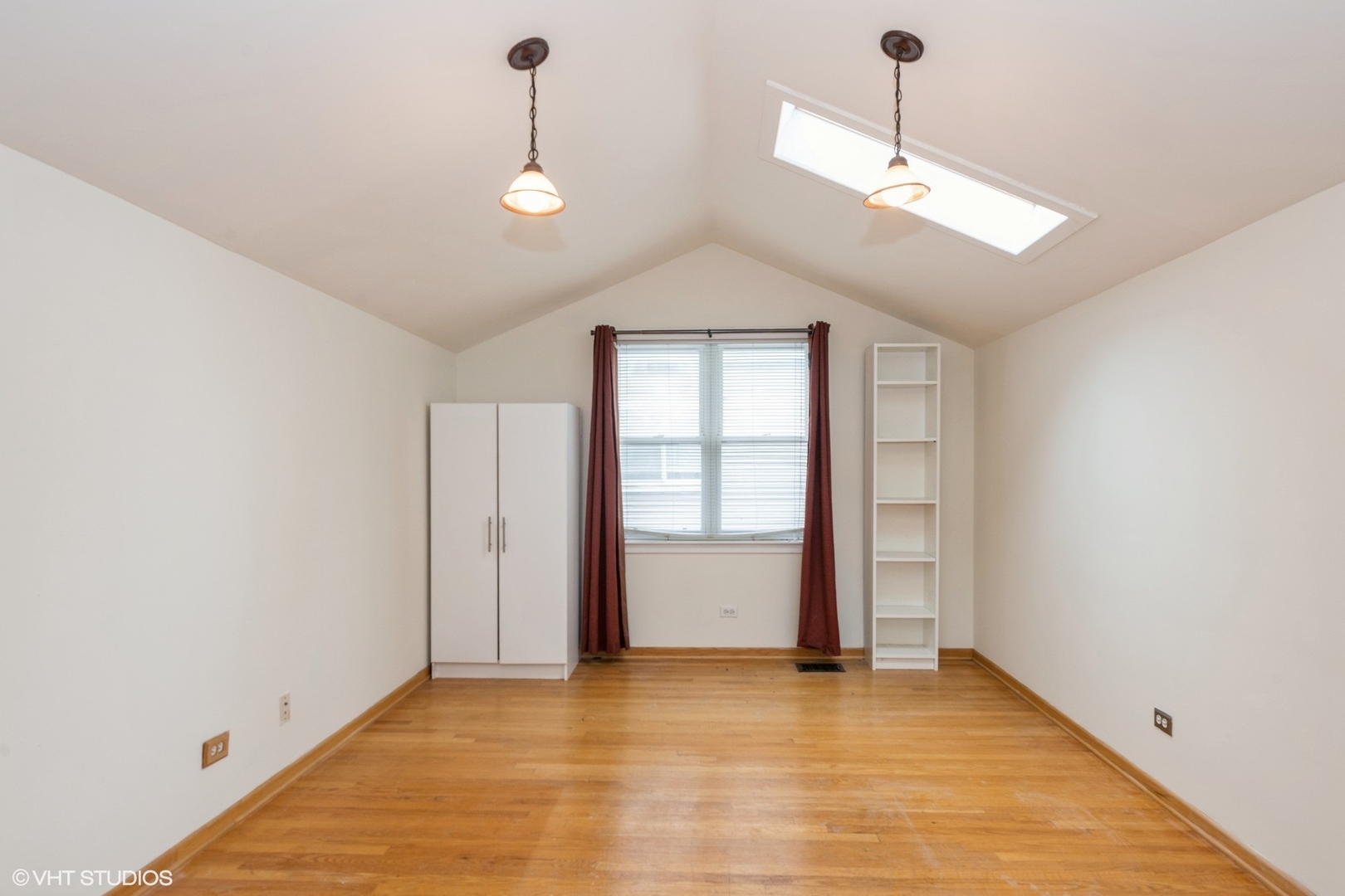 435 Jackson Boulevard Forest Park, IL 60130 - Photo 17 of 19 a view of an empty room with window and wooden floor
