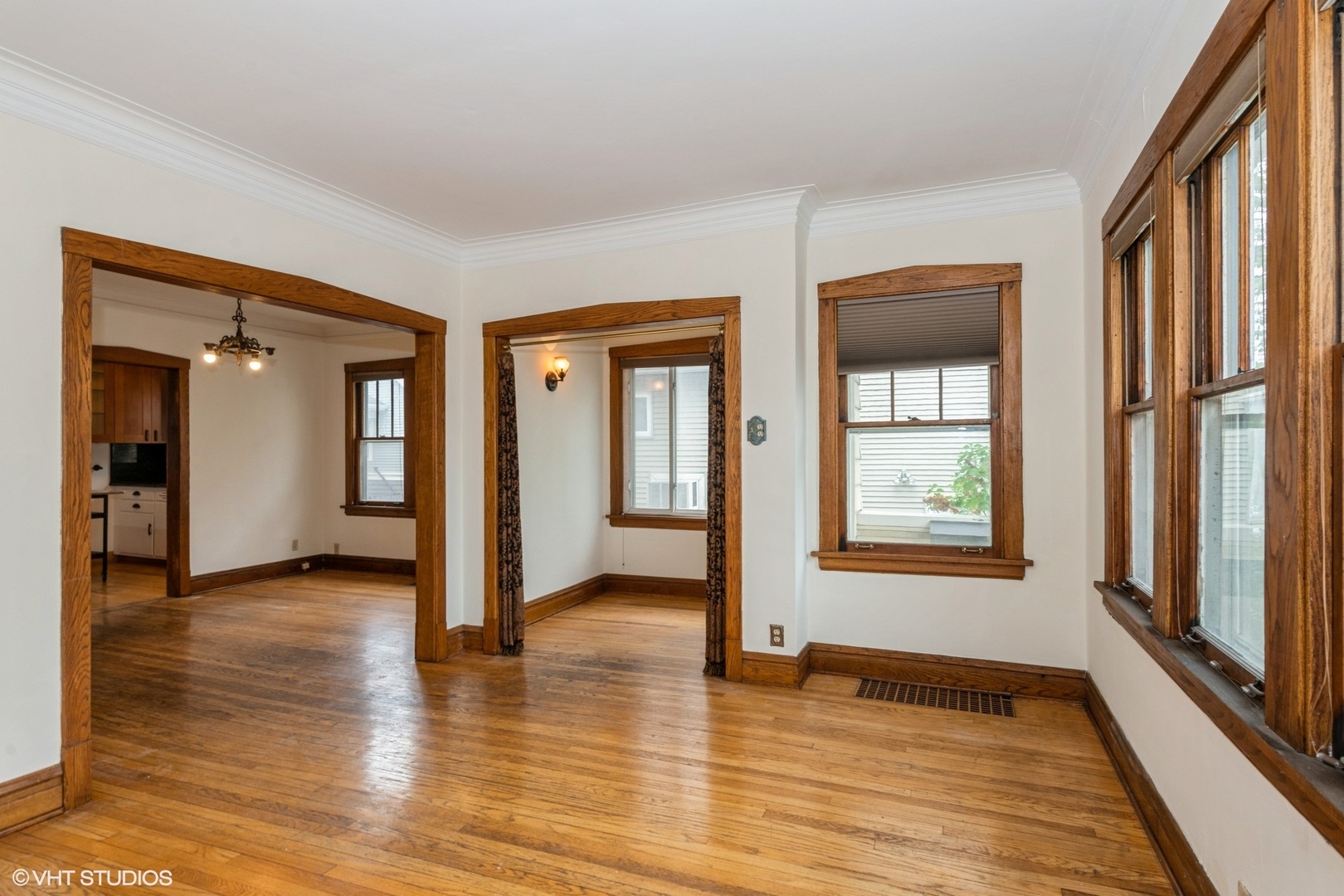 435 Jackson Boulevard Forest Park, IL 60130 - Photo 5 of 19 an empty room with wooden floor and windows