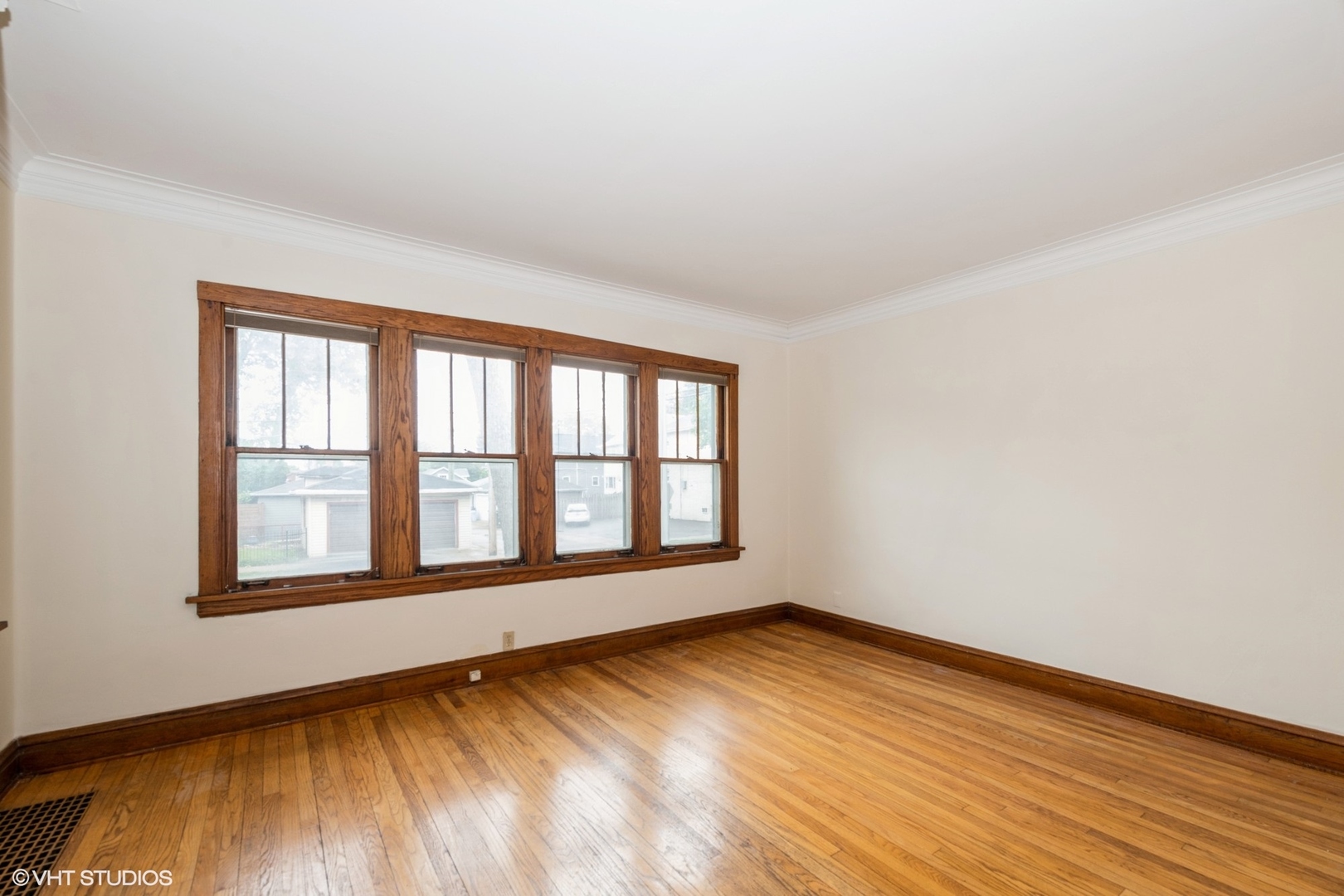 435 Jackson Boulevard Forest Park, IL 60130 - Photo 6 of 19 wooden floor in an empty room with a window
