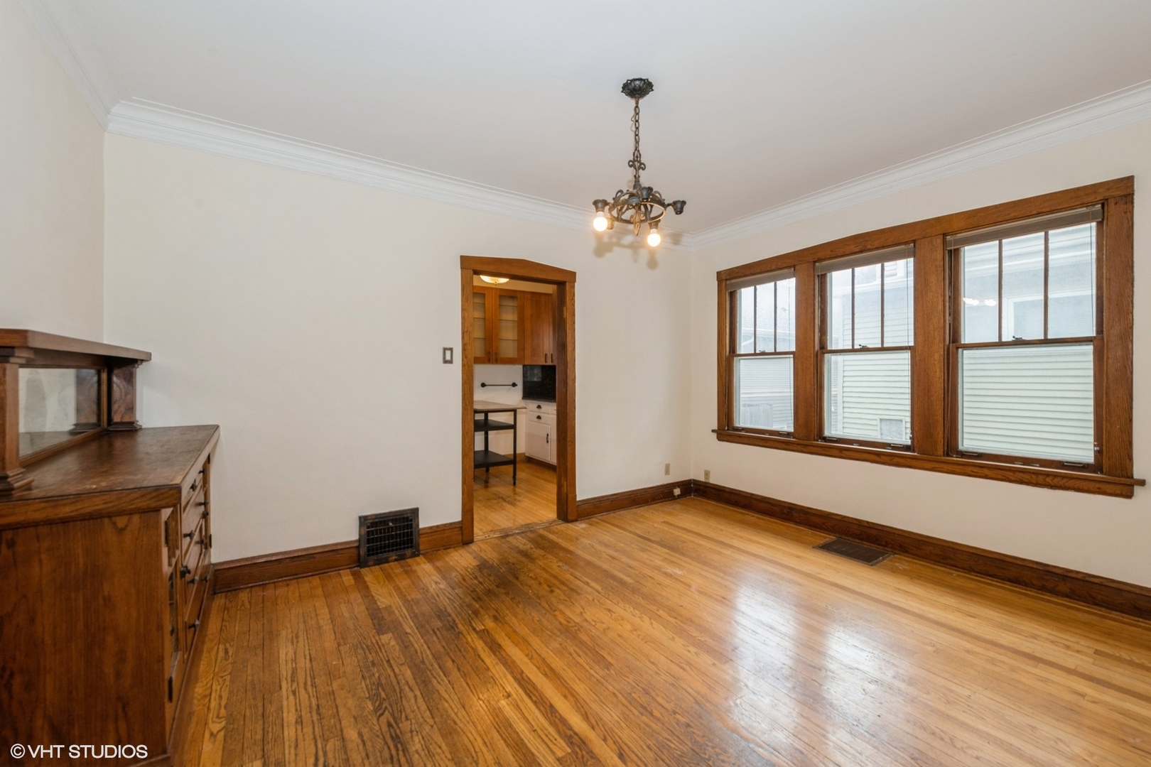 435 Jackson Boulevard Forest Park, IL 60130 - Photo 7 of 19 a view of an empty room with a window and wooden floor