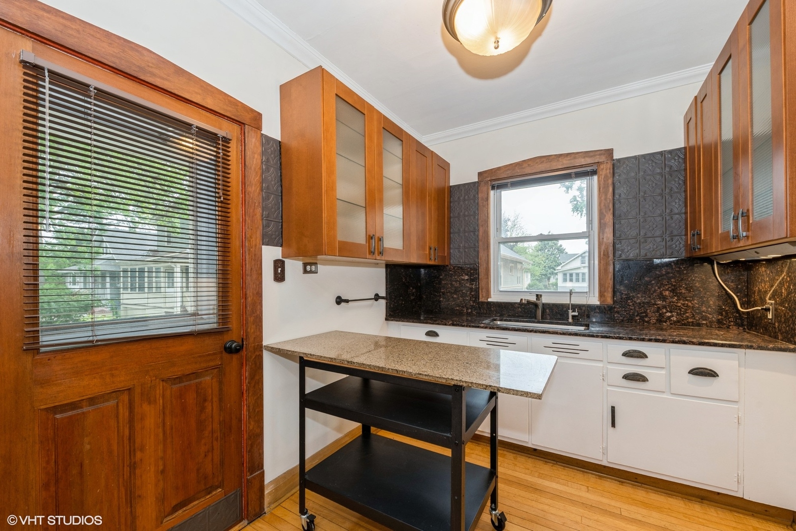 435 Jackson Boulevard Forest Park, IL 60130 - Photo 9 of 19 a kitchen with stainless steel appliances granite countertop a stove a sink and a microwave