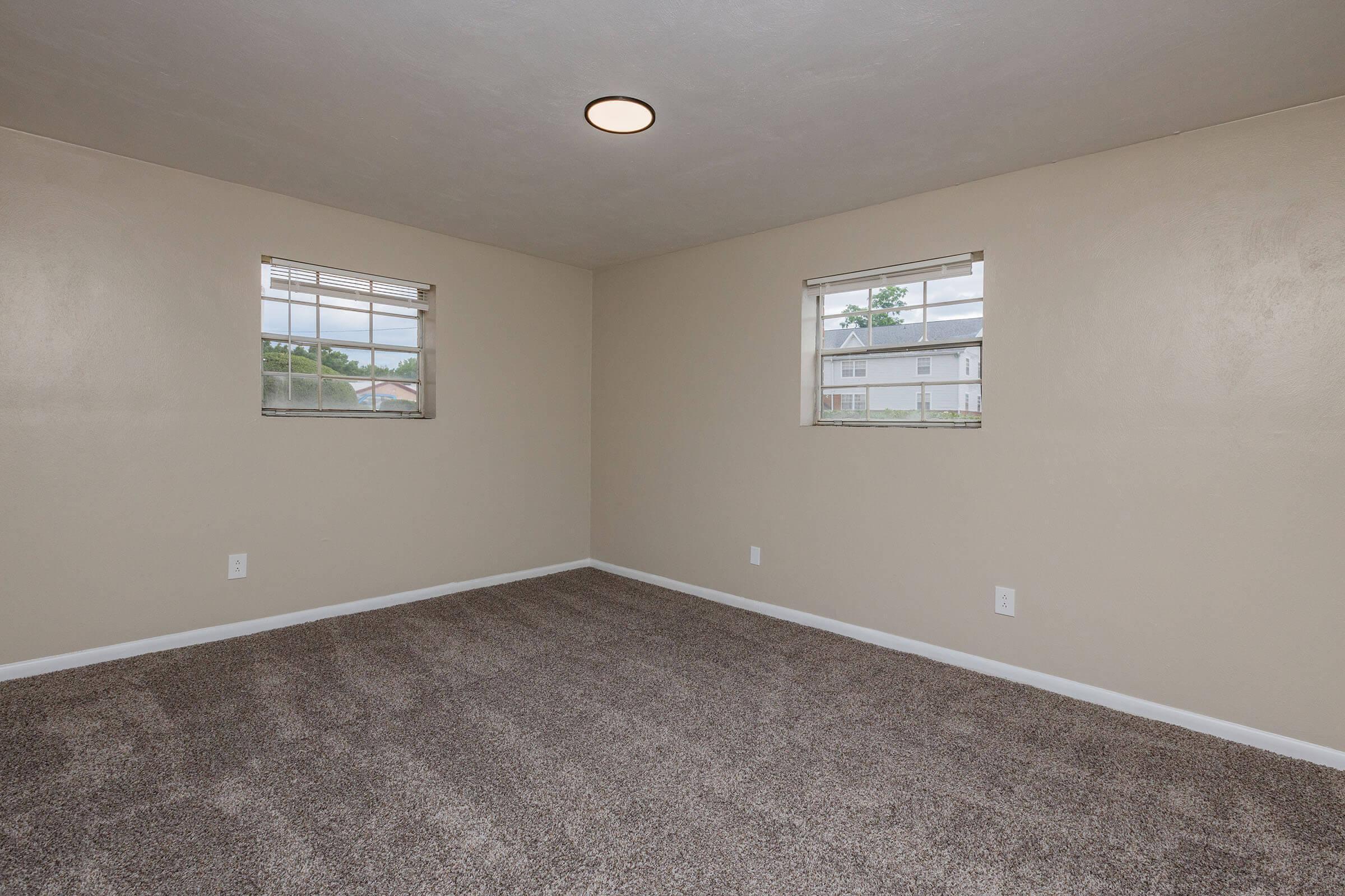 708 Townside Road Southwest, Unit 9 Roanoke, VA 24014 - Photo 16 of 22 an empty room with windows
