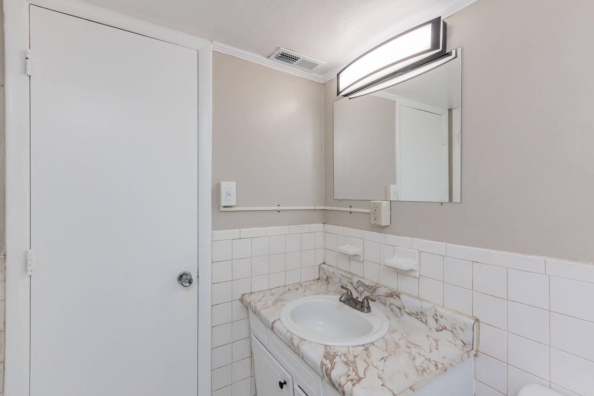 708 Townside Road Southwest, Unit 9 Roanoke, VA 24014 - Photo 19 of 22 a bathroom with a sink and mirror