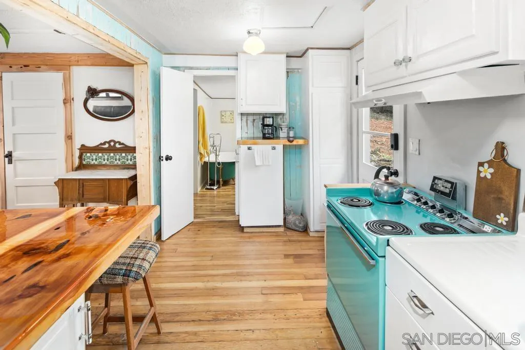 813 Pine Cone Drive Julian, CA 92036 - Photo 11 of 39 a kitchen that has a table and chairs in it