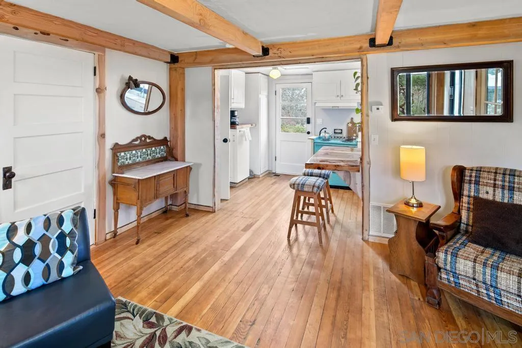 813 Pine Cone Drive Julian, CA 92036 - Photo 13 of 39 a living room with furniture and wooden floor