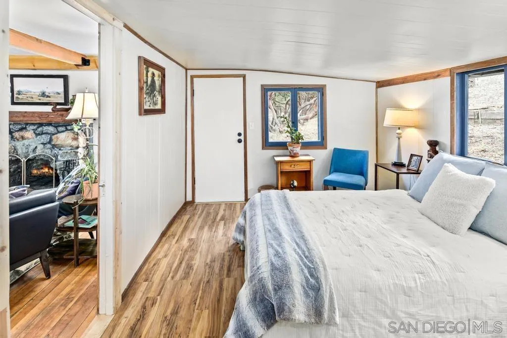 813 Pine Cone Drive Julian, CA 92036 - Photo 17 of 39 a bedroom with a bed and a view of bedroom