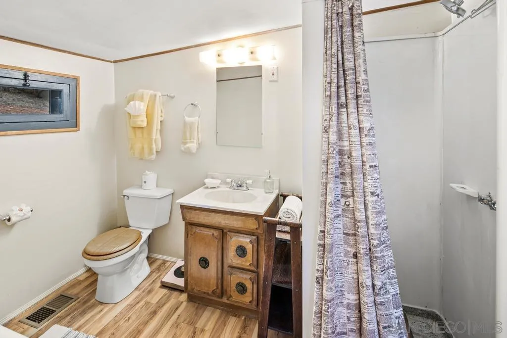 813 Pine Cone Drive Julian, CA 92036 - Photo 18 of 39 a bathroom with a sink toilet and shower